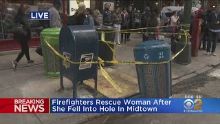 Firefighters Rescue Woman After She Fell Into Hole In Midtown