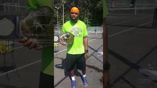 C.E.C shows of his Pickleball Title belt (Coach E. Clark)