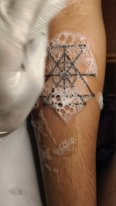attract money tattoo geometric tattoo design