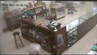 Idiot tries to rob gun store - receives instant justice