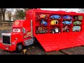 Find a Disney Cars miniature car and put it on the trailer