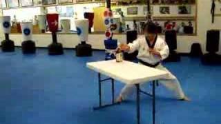 Board breaking- Master Kim breaking a Whiskey bottle