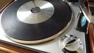 RCA 4 speed automatic record changer playing a stack of 45