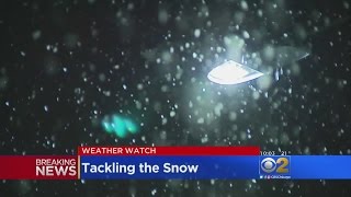 Chicago Residents Keep Up With Snow As It Continues To Fall