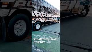 Arrow Stage Lines bus gets stuck. MCI J4500 hung up on high ride driver did a bad approach.