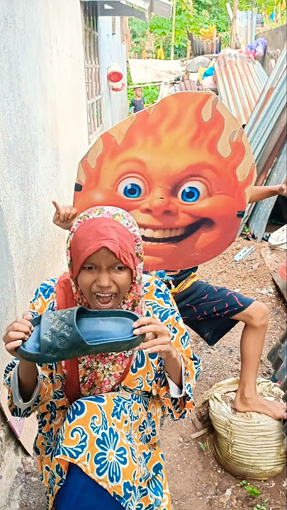 Mother Apipi bites sandals