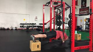 Feet elevated ring push-ups
