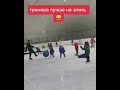 Guy kicks giant ball at kids on ice rink