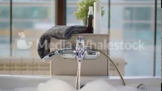Luxurious Bubble Bath With Clear Warm Water Flowing From The Faucet, Spa Concept. Stock Footage
