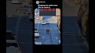 Motorcyclist carrying a road barrier horizontally😱