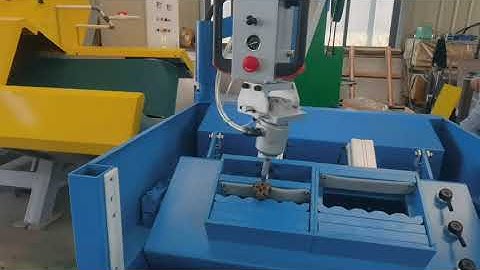 Pneumatic button bits sharpener for old drill bits reusing, with robot arm for automatic grinding.