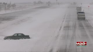 Icy conditions slow traffic on I-90 and send some vehicles into the ditch