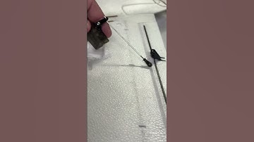 What side does the servo arm go on relative to the control structure of an RC airplane? ￼