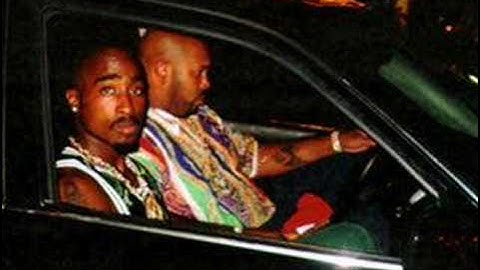 tupac-staring through my rear view