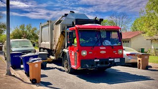 Austins Iconic Red CCC Heil Python Garbage Truck collecting Trash