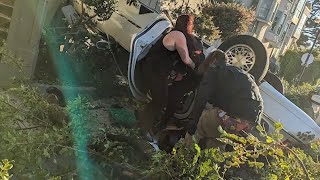 Car flips over San Francisco hillside near stairs
