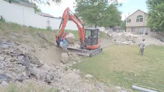 Utah boulder retaining wall contractor in action