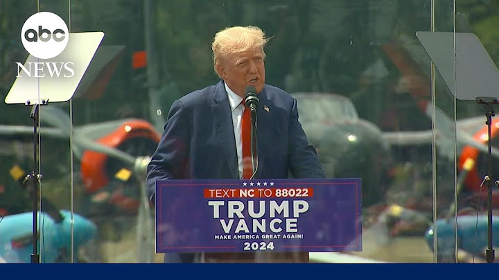 Trump speaks behind bulletproof glass at first outdoor rally since assassination attempt