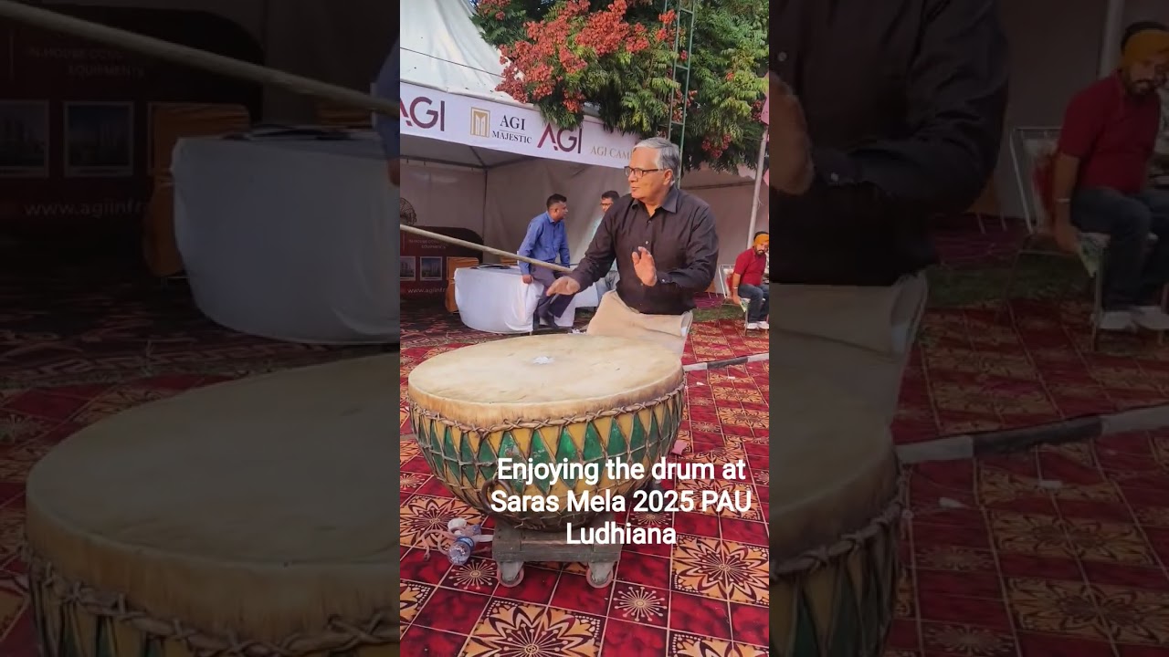 Enjoying playing drums at Saras Mela 2025 PAU Ludhiana