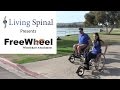 Freewheel wheelchair attachment with living spinal