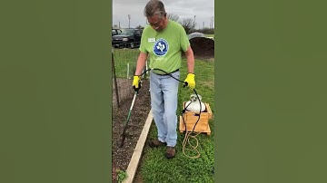 Burning weeds with garden torch