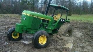 Excavator Pulls out Stuck Deere 4440 Tractor