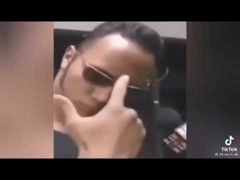 Dwayne Johnson raising eyebrows with sunglasses meme