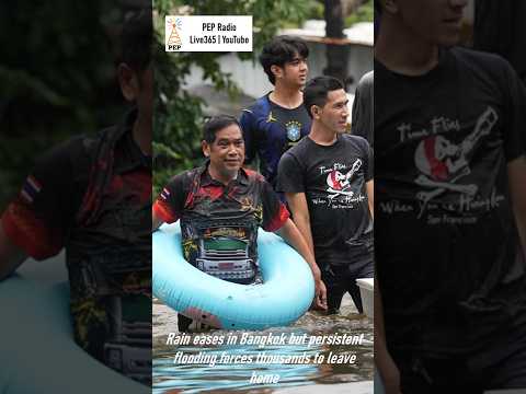 Rain eases in Bangkok but persistent flooding forces thousands to leave home
