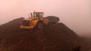 Volvo 180 wheel loader moves dirt