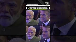 Macron and Modi visit Paris tech conference featuring robots and Eiffel Tower model