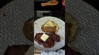 Steak cooked to rare over lump charcoal and baked potato. ##cooking #bbq #recipe #fyp #foodie