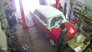 Car Slams Into Workshop Desk While Pulling Onto Lift