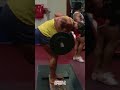 Arnold Schwarzenegger doing bent over rows while filming Pumping Iron