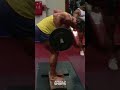 Arnold Schwarzenegger doing bent over rows while filming Pumping Iron