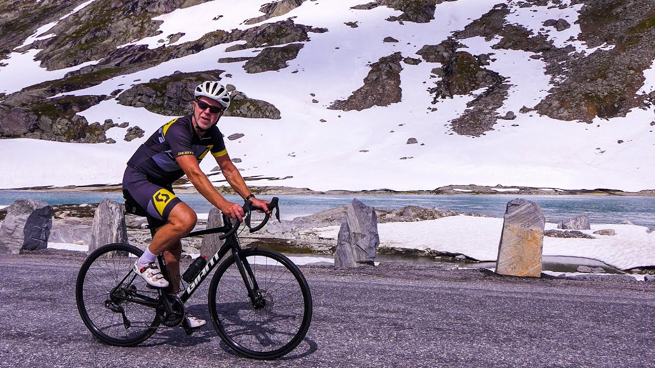 Roadtrip; Stryn to Grotli, with Norwegian scenic route Gamle Strynefjellvegen  Roadbike and car