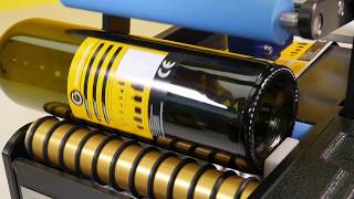 Wine Bottle Labeler  - Wine Bottles being Labelled on the BenchMARK