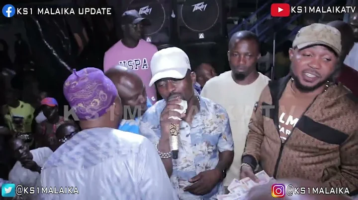 SEE AS SAM LARRY  AND CROWD STAND STILL FOR KS1 MALAIKA AT WAVE BEACH 3