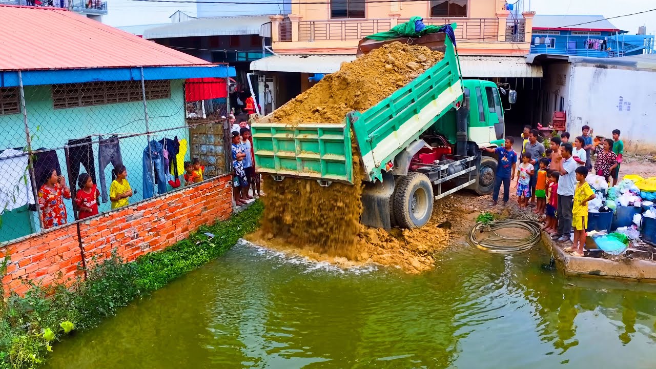 Excellent work Landfill clear garbage build house ! Truck delivery Soil with old bulldozer push soil