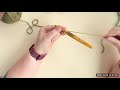 Holding the yarn to keep tension