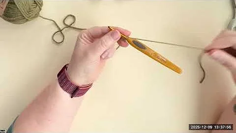 Holding the yarn to keep tension