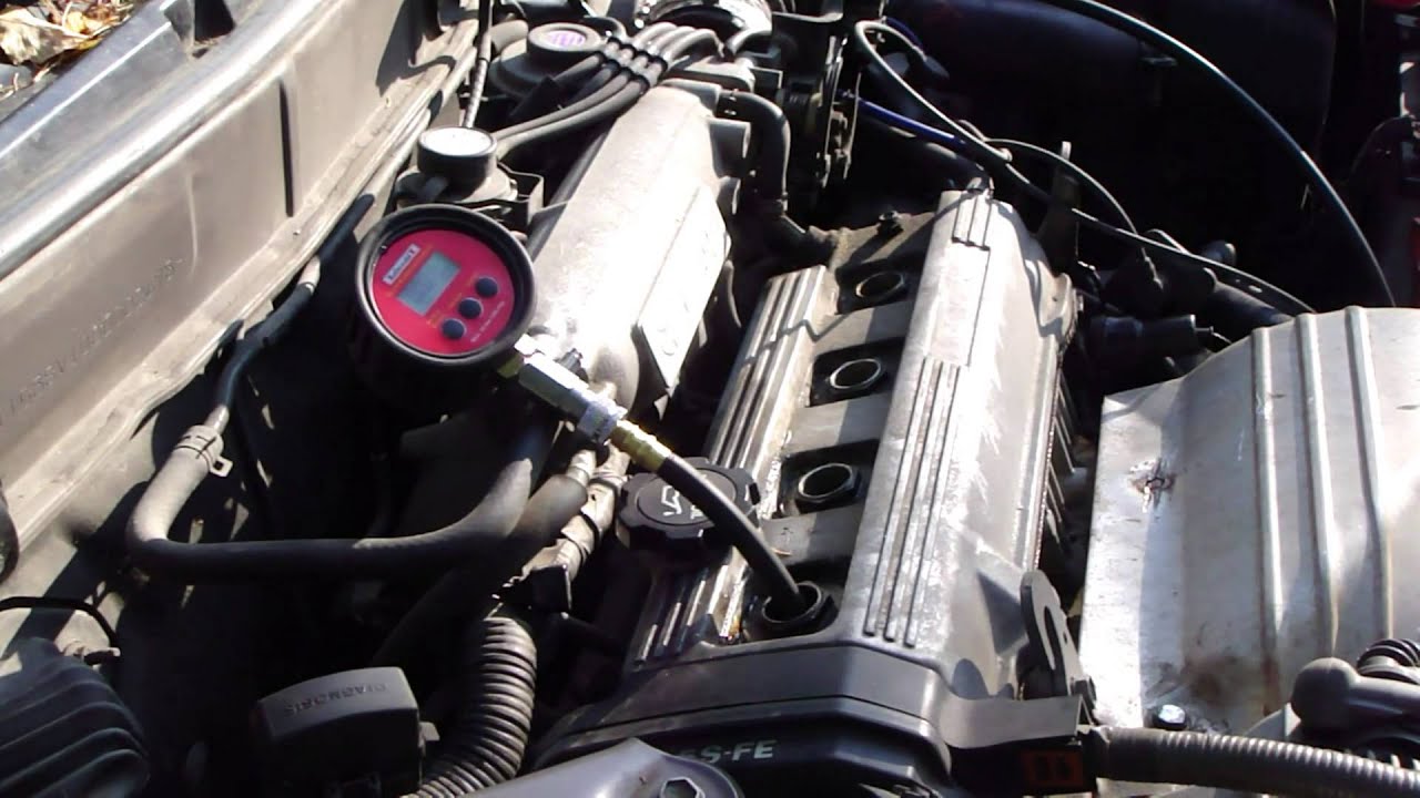 Compression in engine cylinders. Compression check in the cylinder of the car engine Compression in engine cylinders. Compression check in the cylinder of the car engine