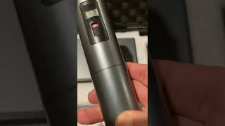 Turning on the Sennheiser e835 wireless mic.