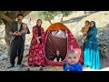Teacher helping a poor nomadic family to buy a tent for a nomadic woman with her children 