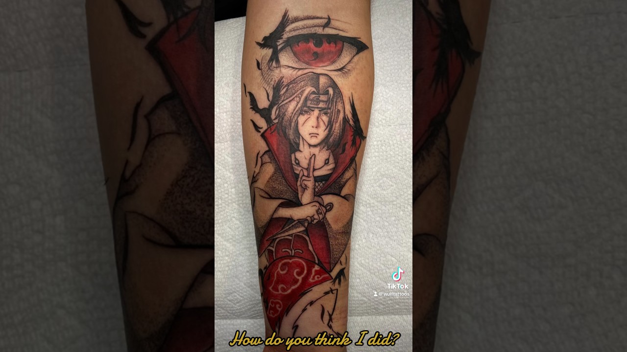 “The Sharingan Revived!” A captivating black and grey tattoo, with a hint of color 