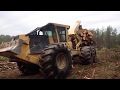 A loaded Peterbilt log truck in the ditch & our Tigercat 635D