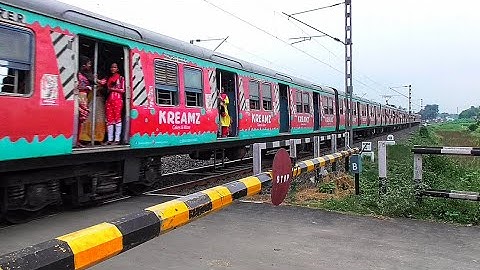 Beautiful Ad printed Colourful 09 Coach Sealdah-Katwa EMU Local Furiously Skipping through Railgate