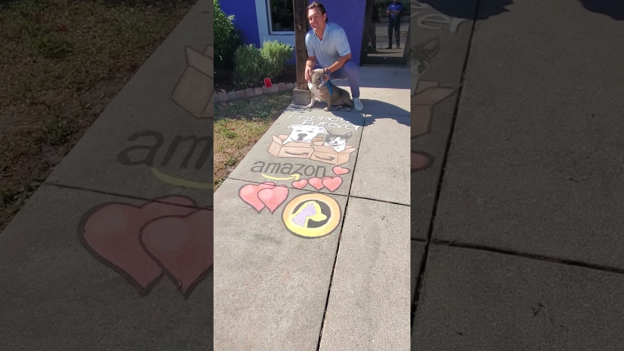 TV personality Tyler Cameron and GCHS shelter dog, Penelope, pose for pics