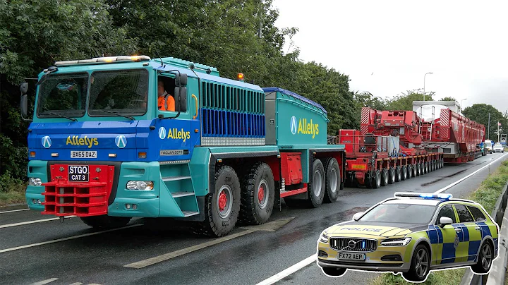 Very heavy 706 tonne transport with 280 wheels squeezes through tight bend as police shut roads