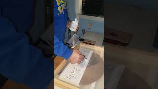 Making custom wood round signs.