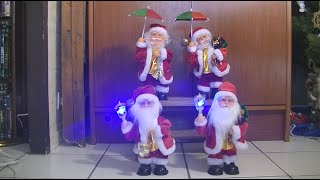 The complete serie of the dancing Santa Claus with an umbrella and a lantern